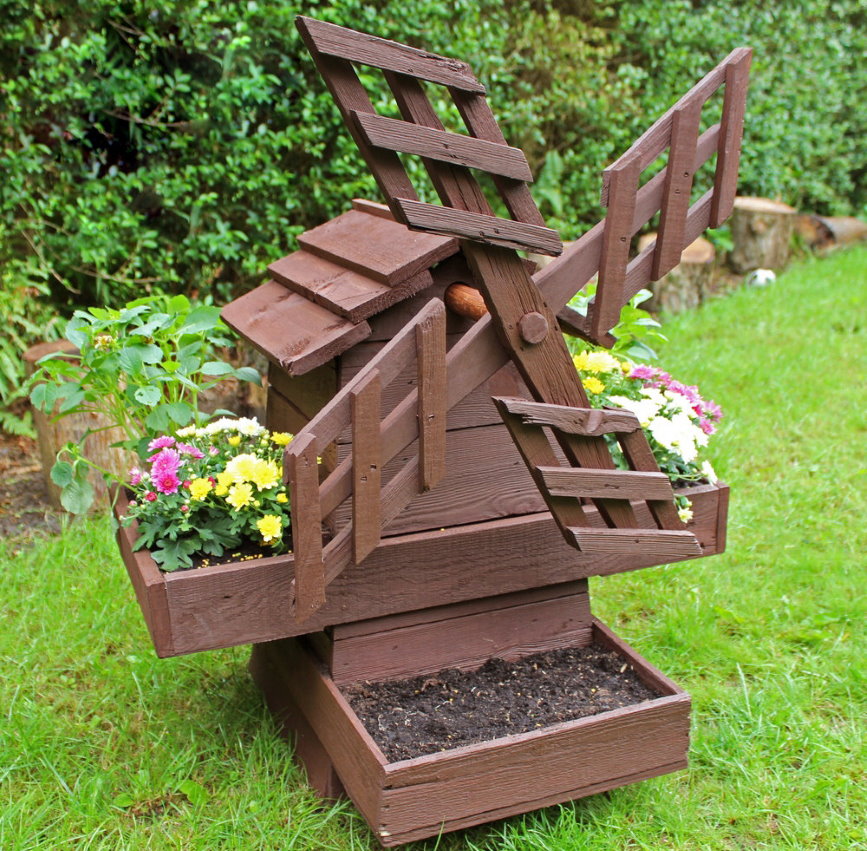 Homemade mill shaped flowerbed