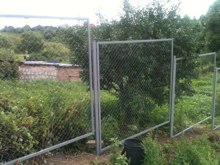 Sectional fence from a chain-link in a section with elevations
