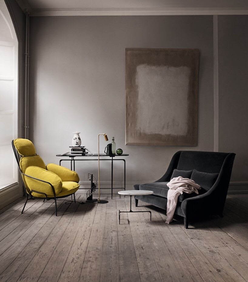Light gray room with a yellow armchair
