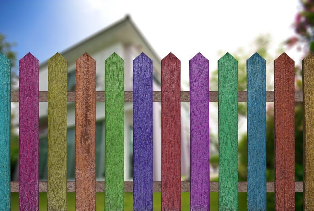 Colorful fence made of cheap picket fence