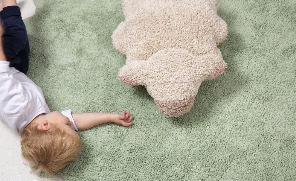 Preschool child on a soft carpet