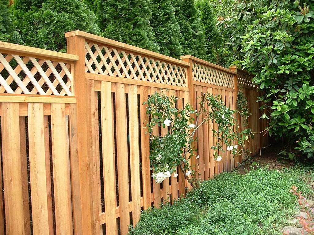 Wooden grilles at the top of the garden fence