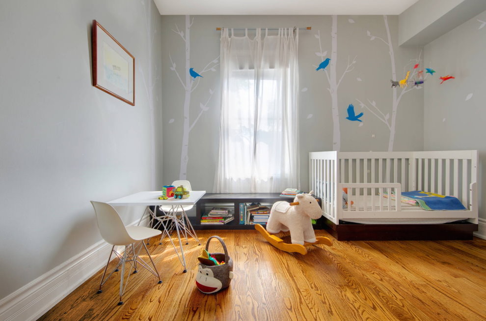 Decor of gray walls in a baby room