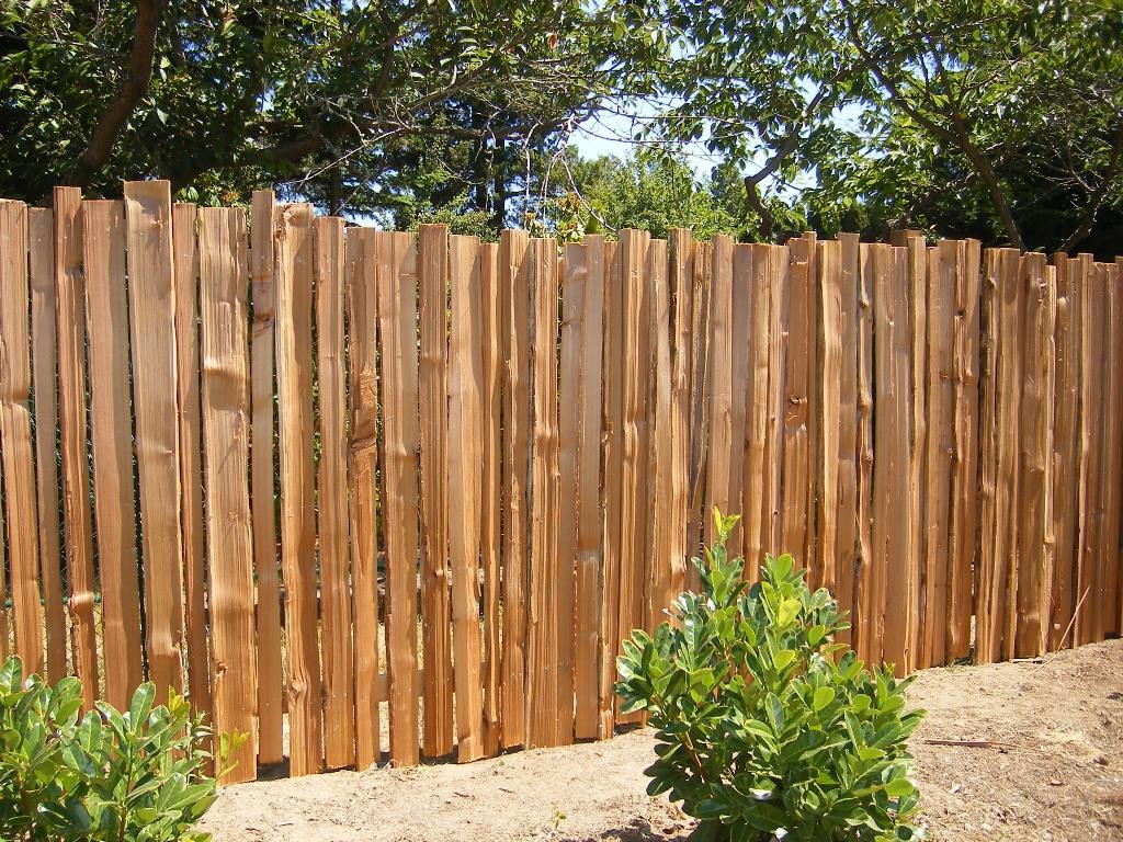Wooden fence made of croaker in a summer cottage