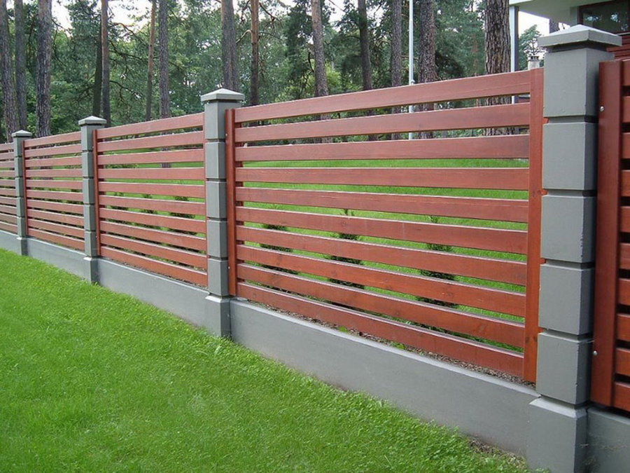 Modern wooden fence in cross style.