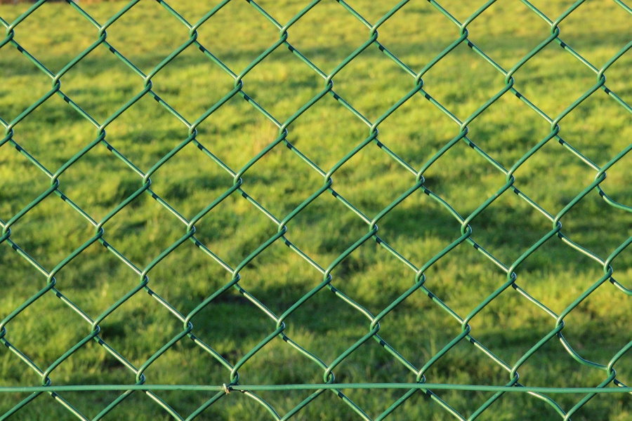 Green mesh netting on a garden fence