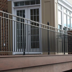 Lattice railing between brick columns