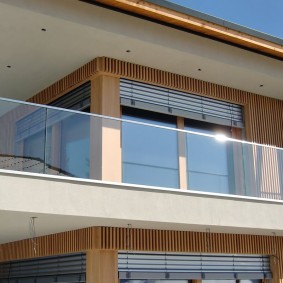 Glass railing of a long balcony