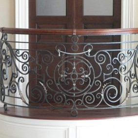 Forged items on the railing of the balcony