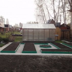 Polycarbonate greenhouse on a wooden frame