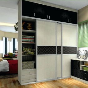 Wardrobe with sliding doors in a studio apartment