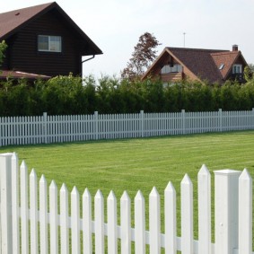 Beautiful fence made of white picket fence