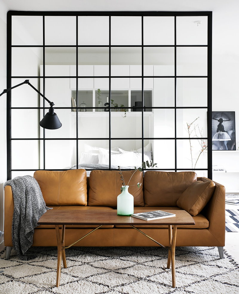 Leather sofa in front of a glass partition