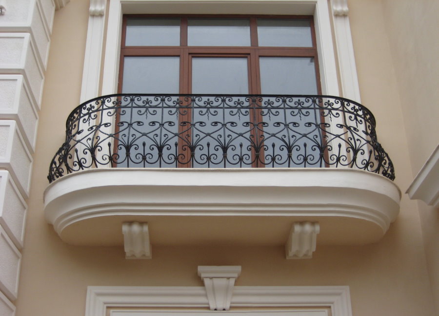 Forged fence on the balcony of a private house