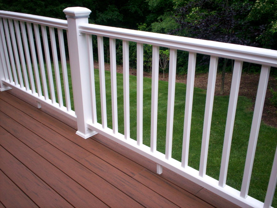White plastic railing on the balcony of a country house